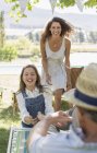Happy caucasian family playing outdoors — Stock Photo