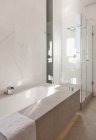 Bathtub and shower in modern bathroom — Stock Photo
