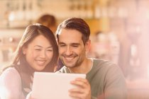 Couple video chatting with digital tablet — Stock Photo