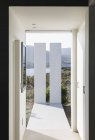 Sunny modern luxury home showcase interior corridor — Stock Photo