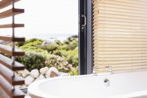 Home showcase soaking tub with view — Stock Photo