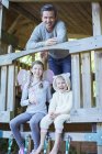 Father and children playing on playset — Stock Photo