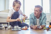 Father and son playing together — Stock Photo