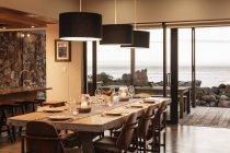 Home showcase dining room overlooking ocean — Stock Photo