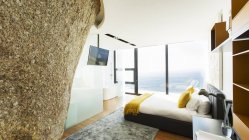 Rock feature in modern bedroom — Stock Photo