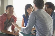 Happy creative business people in meeting — Stock Photo