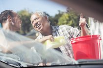 Father and son washing car — Stock Photo