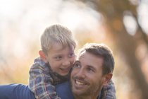 Affectionate father and son piggybacking — Stock Photo