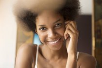 Close up of woman smiling face at home — Stock Photo