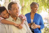Happy grandparents and grandson on porch — Stock Photo