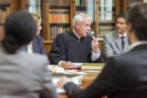 Judge and lawyers talking in chambers — Stock Photo