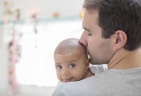 Father kissing baby boy — Stock Photo
