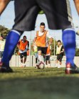 Soccer players training tricks on field — Stock Photo