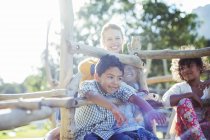 Teacher and students playing on play structure — Stock Photo