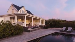 White home showcase exterior beach house at dusk — Stock Photo
