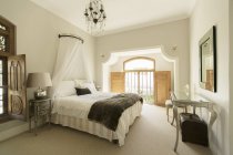 Elegant bedroom  indoors during daytime — Stock Photo