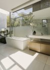 Sunny modern luxury home showcase bathroom — Stock Photo
