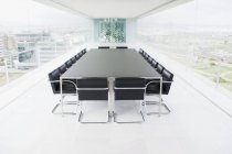 Empty conference room overlooking city — Stock Photo