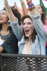 Woman cheering at music festival — Stock Photo