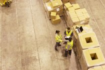 Overhead of Workers talking in warehouse — Stock Photo