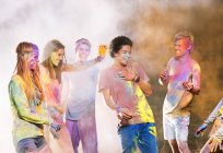 Friends covered in chalk dye at music festival — Stock Photo