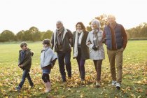 Caucasian family walking together in park — Stock Photo
