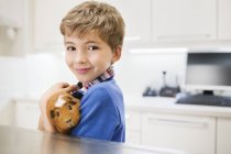 Boy holding guinea pig in veterinary surgery — Stock Photo