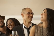 Young attractive Friends laughing at party — Stock Photo