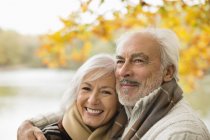 Caucasian older couple hugging in park — Stock Photo