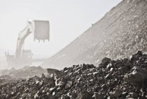 Digger working in quarry during daytime — Stock Photo