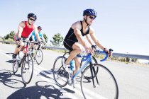 Cyclists in race on rural road — Stock Photo
