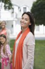 Three generations of women smiling outdoors — Stock Photo