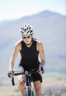Cyclist on rural road — Stock Photo