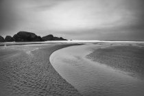 Creek connecting to ocean, balck and white — Stock Photo