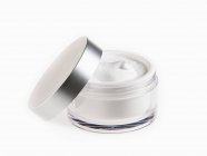 Close up of moisturizer in jar on white background — Stock Photo