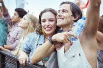 Couple cheering at music festival — Stock Photo