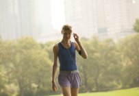 Runner walking in urban park — Stock Photo