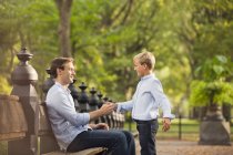 Father and son in urban park — Stock Photo