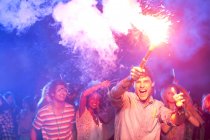 Fans with fireworks at music festival — Stock Photo