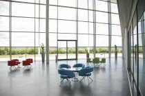 Chairs and tables in office lobby area — Stock Photo