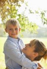 Mother and son hugging in park — Stock Photo