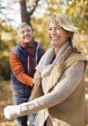 Older couple walking together in park — Stock Photo
