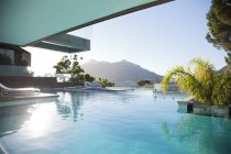 Luxury swimming pool with mountain view — Stock Photo