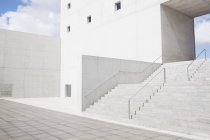 Facade of white modern building and stairs — Stock Photo