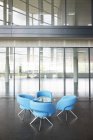 Chairs and table in office lobby area — Stock Photo