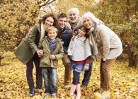 Happy family smiling together in park — Stock Photo