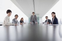 Portrait of smiling business people in conference room — Stock Photo