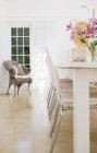 Chairs at table in dining room — Stock Photo