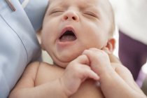 Close up of newborn baby yawning — Stock Photo