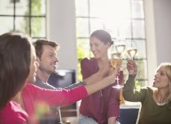 Friends toasting each other with wine — Stock Photo